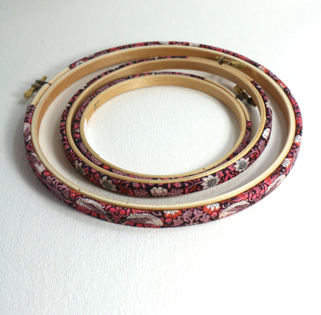 Embroidery hoop wrapped in Pink 'Strawberry Thief' fabric, 'Strawberry Thief' fabric was designed by William Morris, a name famous within the Arts and Crafts movement.