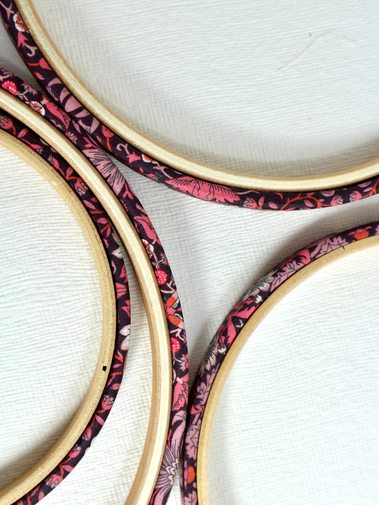 Front view of Embroidery hoop wrapped in Pink 'Strawberry Thief' fabric, 'Strawberry Thief' fabric was designed by William Morris, a name famous within the Arts and Crafts movement.