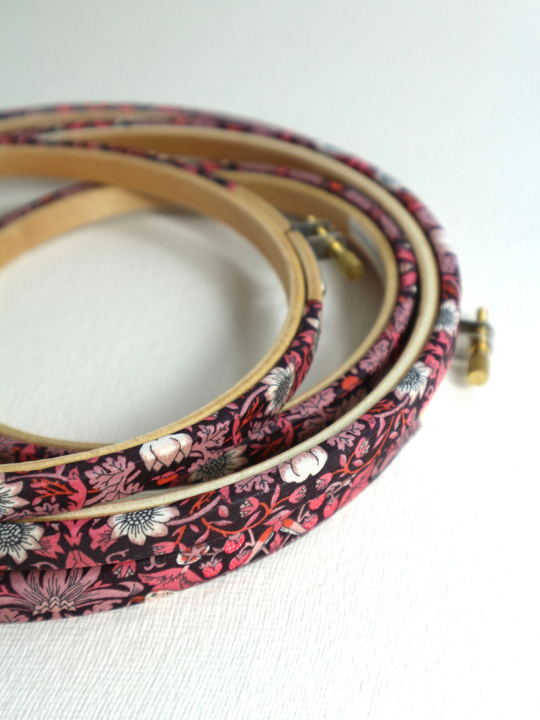 Embroidery hoops wrapped in Pink 'Strawberry Thief' fabric, 'Strawberry Thief' fabric was designed by William Morris, a name famous within the Arts and Crafts movement.