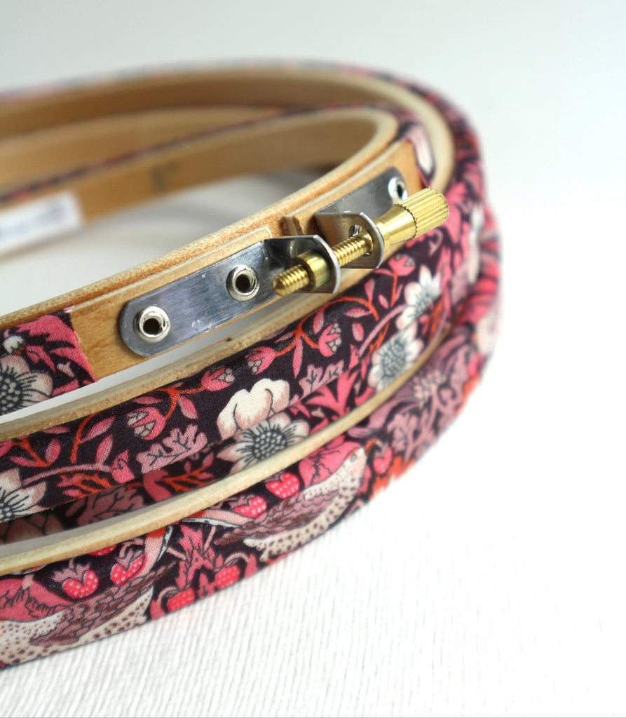Embroidery hoop wrapped in Pink 'Strawberry Thief' fabric, 'Strawberry Thief' fabric was designed by William Morris, a name famous within the Arts and Crafts movement.