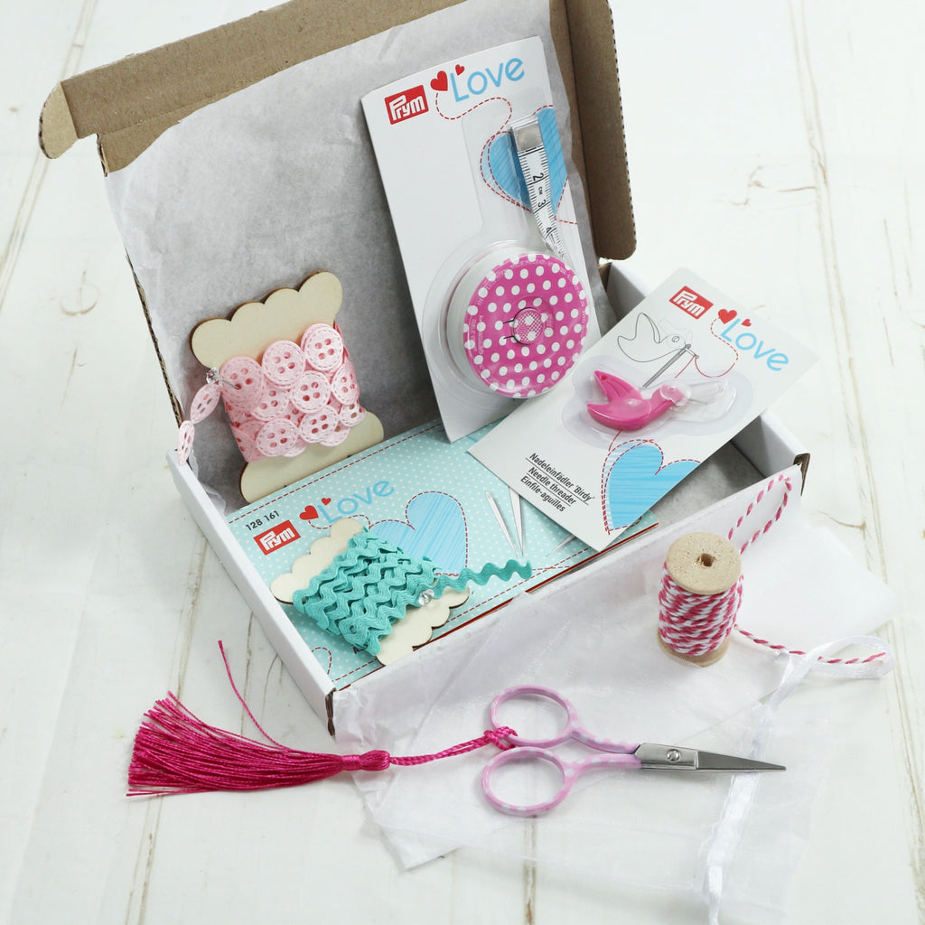 Pretty Gifts For Sewer. Tape measure, needle threader, needle book, embroidery scissors. Turquoise and pink polka dots.