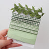 Green leaf ribbon collection wound on to a card.