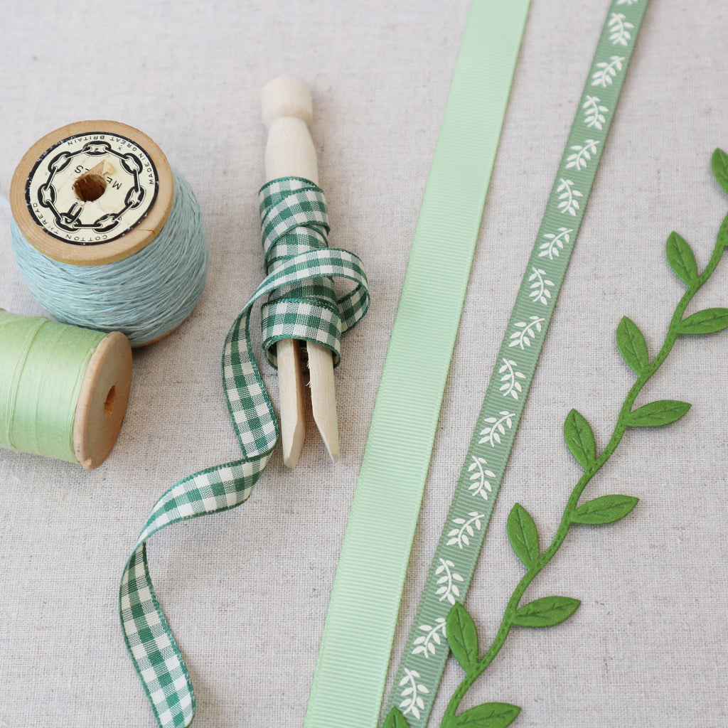 four green ribbons. gingham and leaf ribbons