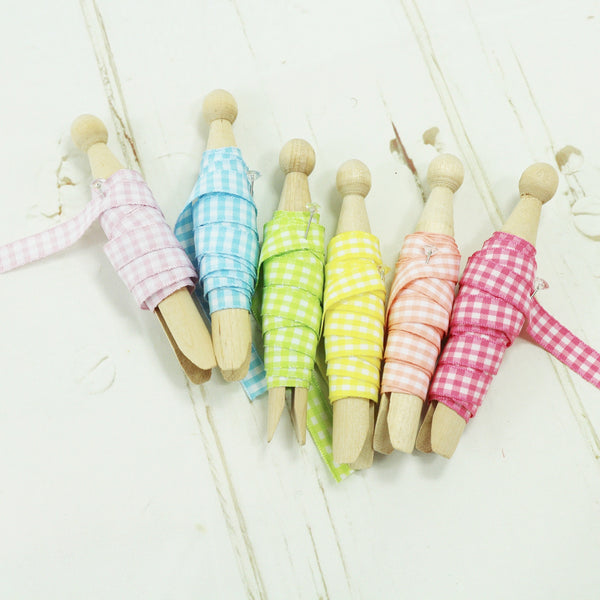 summer gingham ribbon wrapped on wooden pegs
