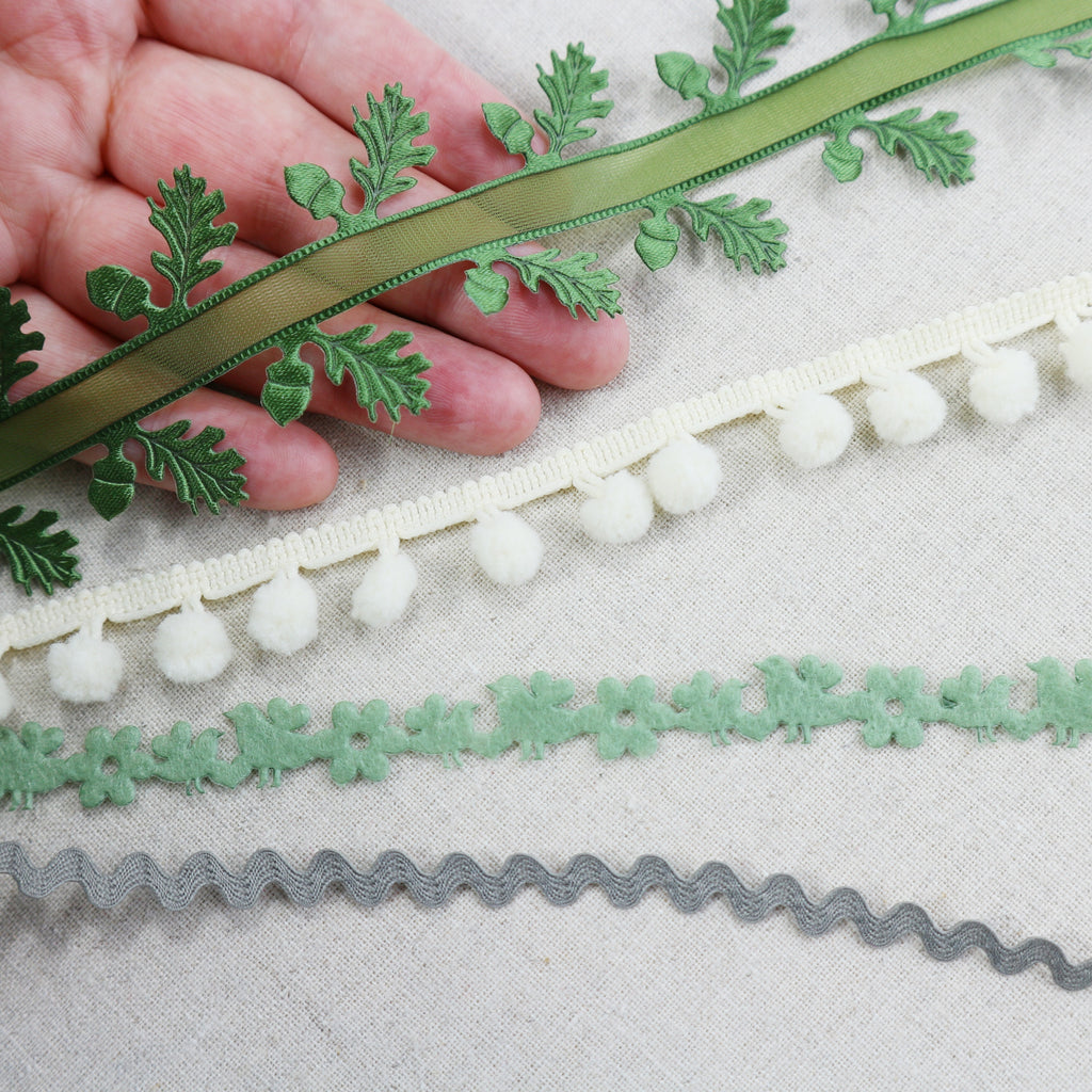green woodland ribbon with hand for scale