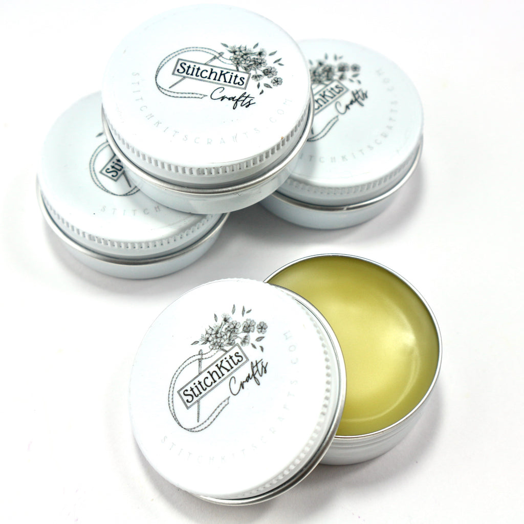 Bees wax thread conditioner in cute white tin.