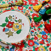 Betsy star free cross stitch design with metallic stars and embroidery threads.