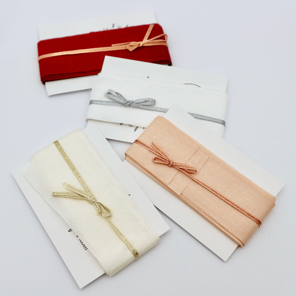 faux silk wedding ribbon in white, ivory, deep red and champagne .