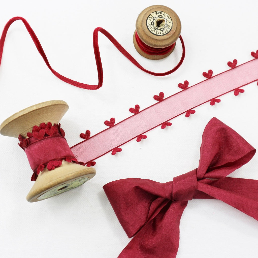 Dark red faux silk, velvet ribbon and sheer ribbon with a satin heart edge.