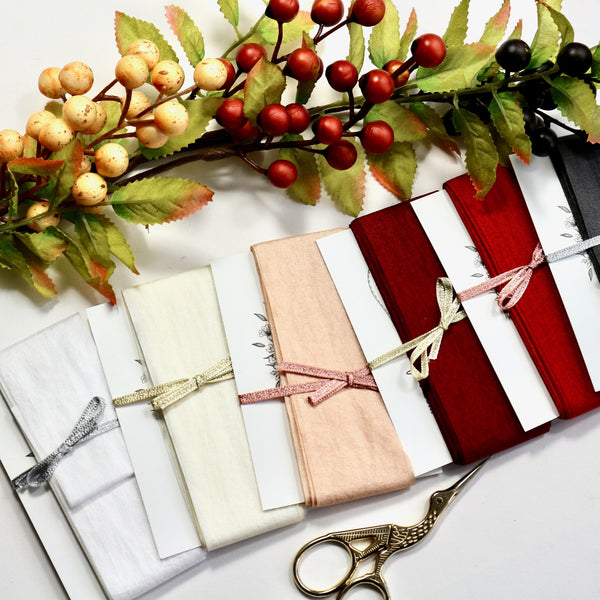 38 mm wide faux silk ribbon on cards in 7 different colours.