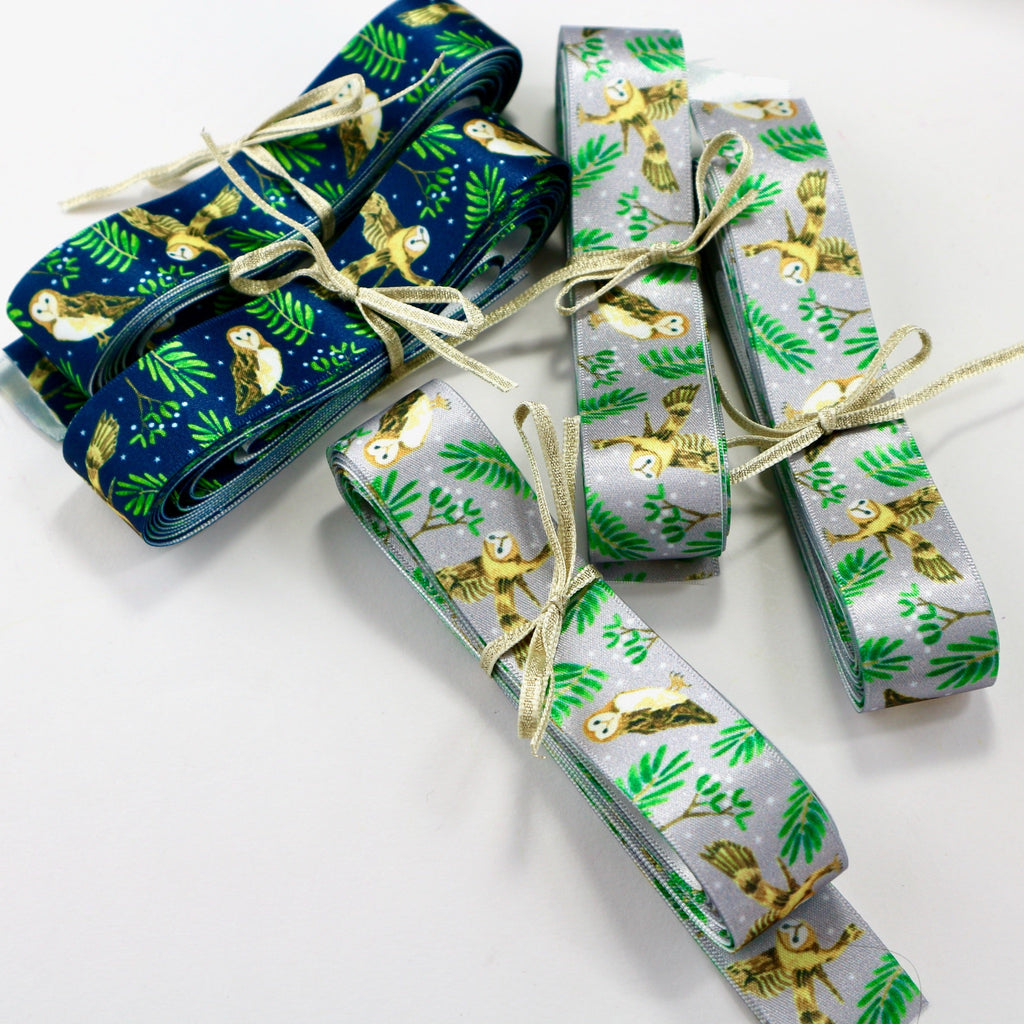 silver grey and navy blue, owl and mistletoe ribbon.