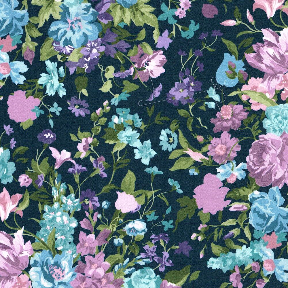 Floral pattern with pink, blue, and purple flowers on a dark blue background