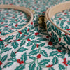 Embroidery hoops with holly leaf and berry pattern fabric