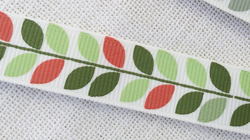 red and green leaf on white grosgrain