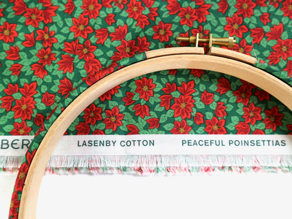 Embroidery hoop on Lazenby Cotton 'Peaceful Poinsettias' fabric