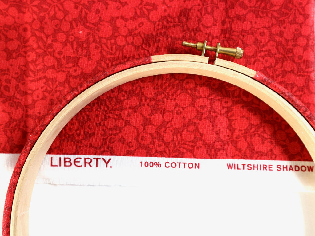 Wooden embroidery hoop on a Liberty fabric with 'Wiltshire Shadow' print.