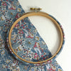 wooden embroidery hoop wrapped in Spring Blue, strawberry thief tana lawn cotton