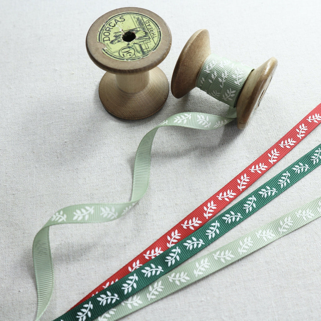 green and red Christmas ribbon with a leaf design
