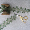 oak leaf ribbon on a vintage cotton reel