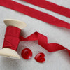 red-faux-silk-ribbon-on-cotton-reel