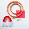 Red neon Pantone embroidery hoop with crochet rainbow