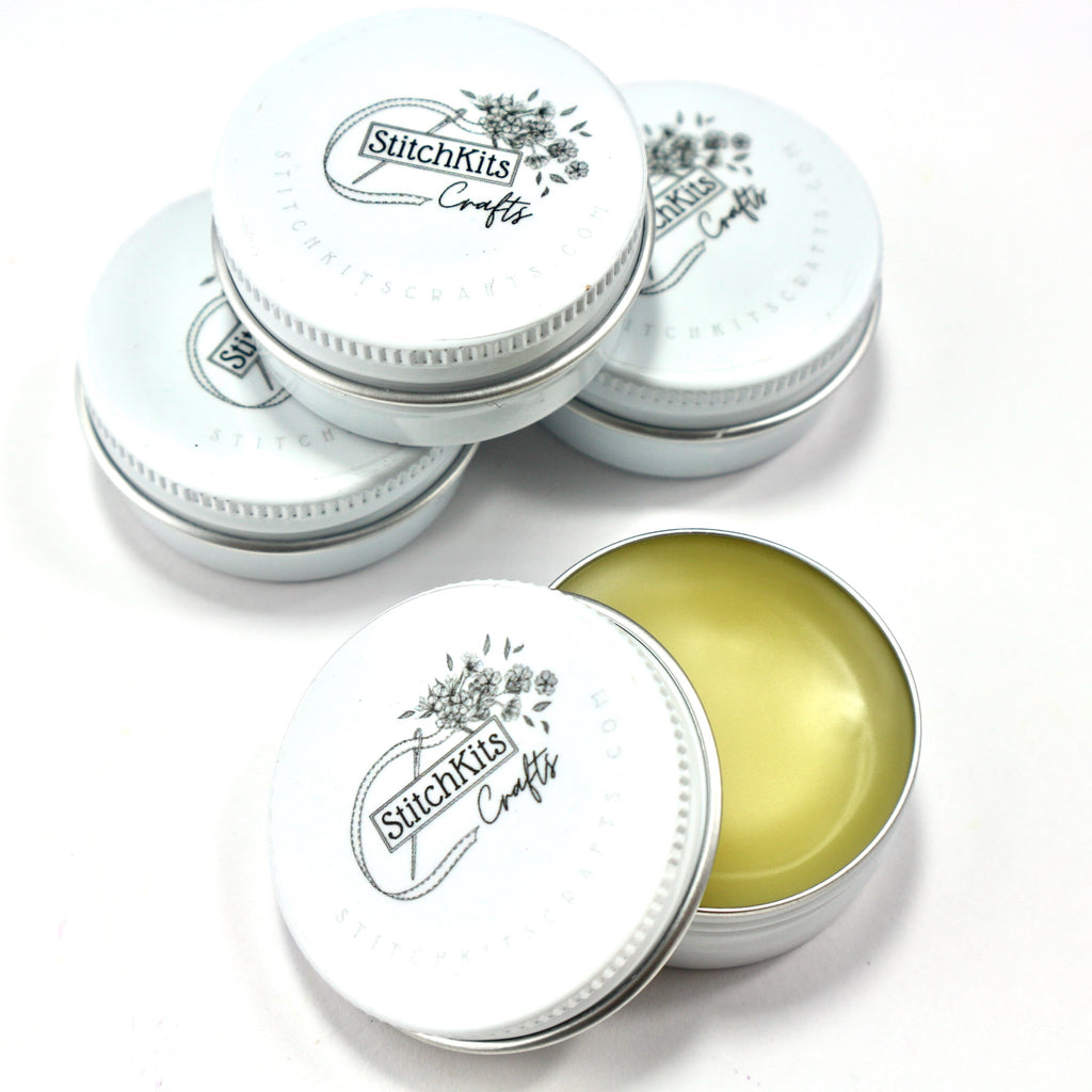 Bees wax thread conditioner in cute white tin.