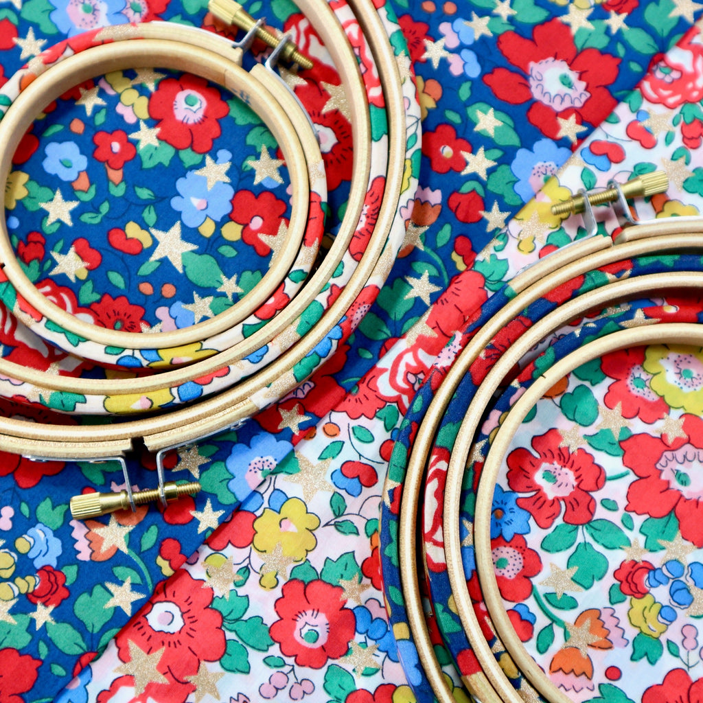 Betsy star Tana Lawn fabric with fabric covered embroidery hoop frames.