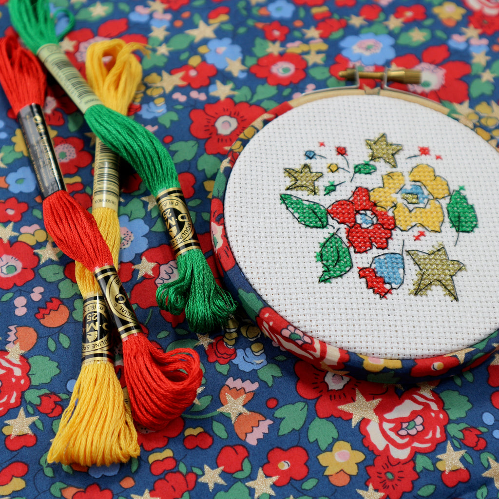 Christmas cross stitch in matching embroidery hoop.