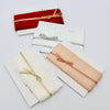 faux silk wedding ribbon in white, ivory, deep red and champagne .