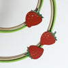 green and red embroidery hoop with hand painted strawberries