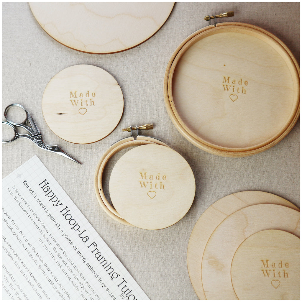 Wooden embroidery hoops with wooden backs.