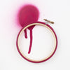 Dark pink 5 inch embroidery hoop with spray painted background
