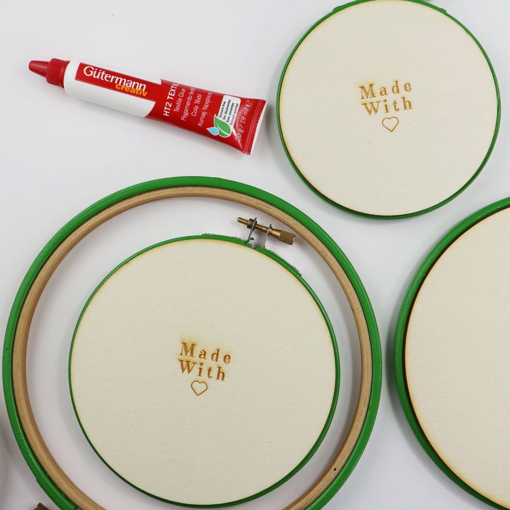 green embroidery hoops with wooden backs.