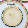 blue embroidery hoop with a wooden back