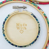 coloured embroidery hoop with wooden back for finishing