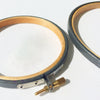 Gray embroidery hoops for framing.