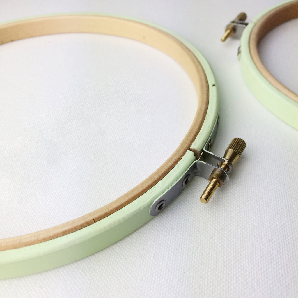 Green coloured embroidery hoops for framing cross stitch and embroidery.