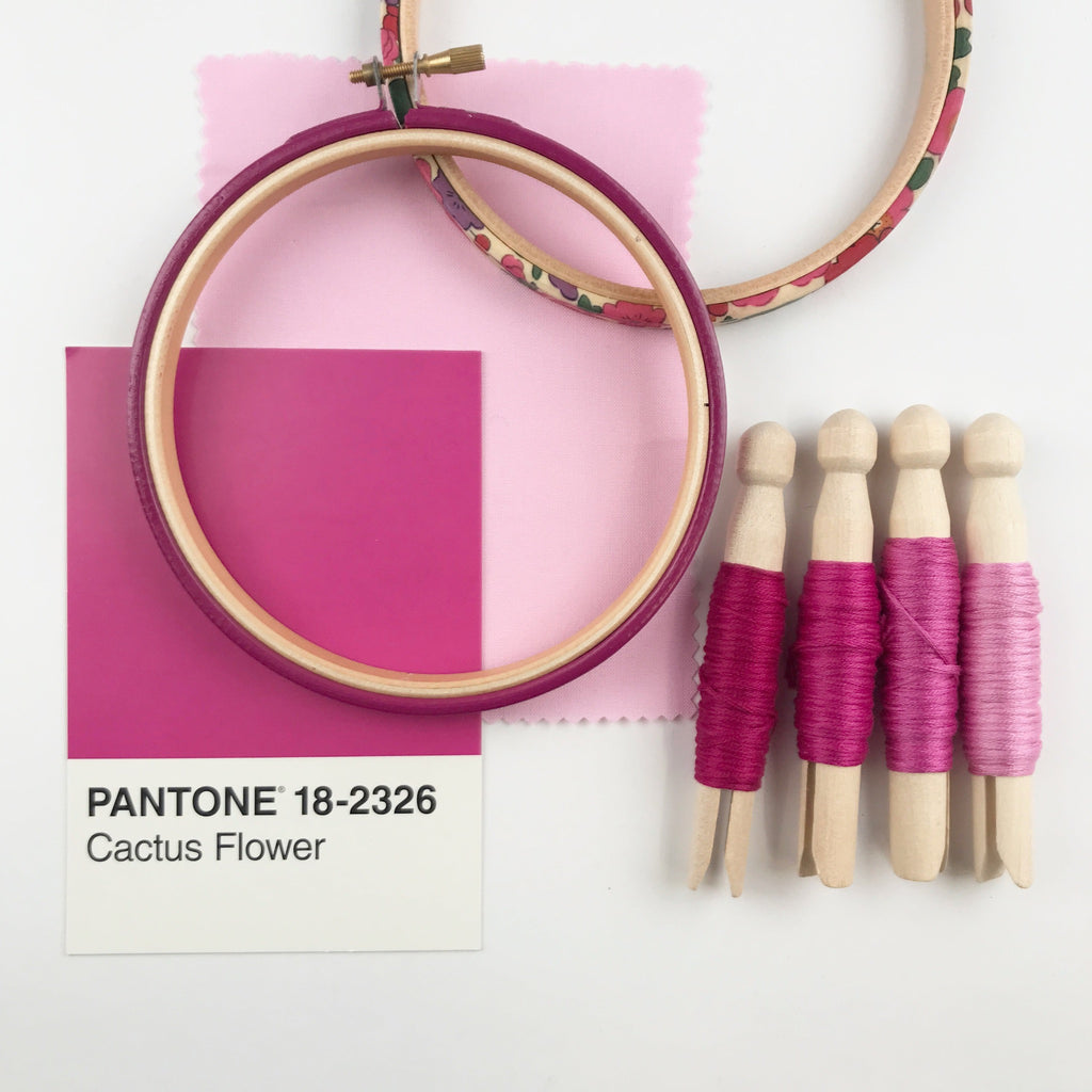Pink embroidery hoop mood board with DMC treads, Kona cotton, Pantone colour card and Tana Lawn embroidery hoop.