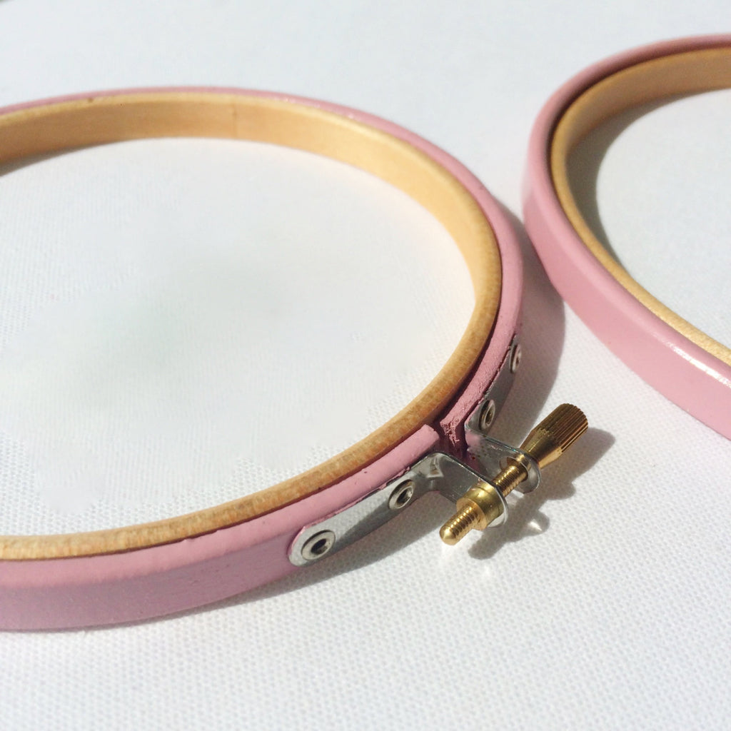 Pink painted embroidery hoops. 