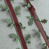 green satin leaf ribbon with a sheer red centre