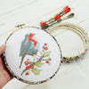Wiltshire berry embroidery hoop framing a robin cross stitch kit