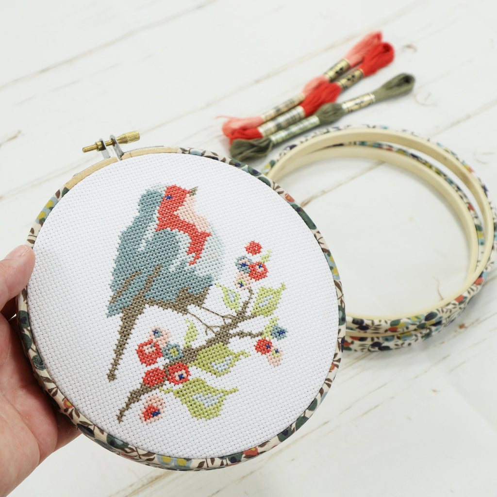 Wiltshire berry embroidery hoop framing a robin cross stitch kit
