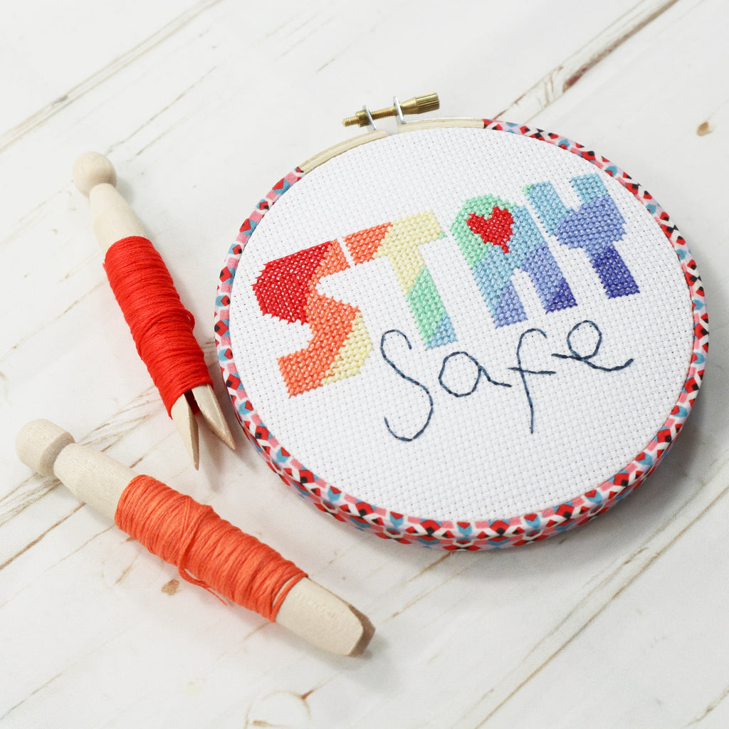 Colourful modern cross stitch in embroidery hoop