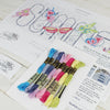 summer butterfly cross stitch kit contents. Cross stitch chart with  colourful embroidery threads.