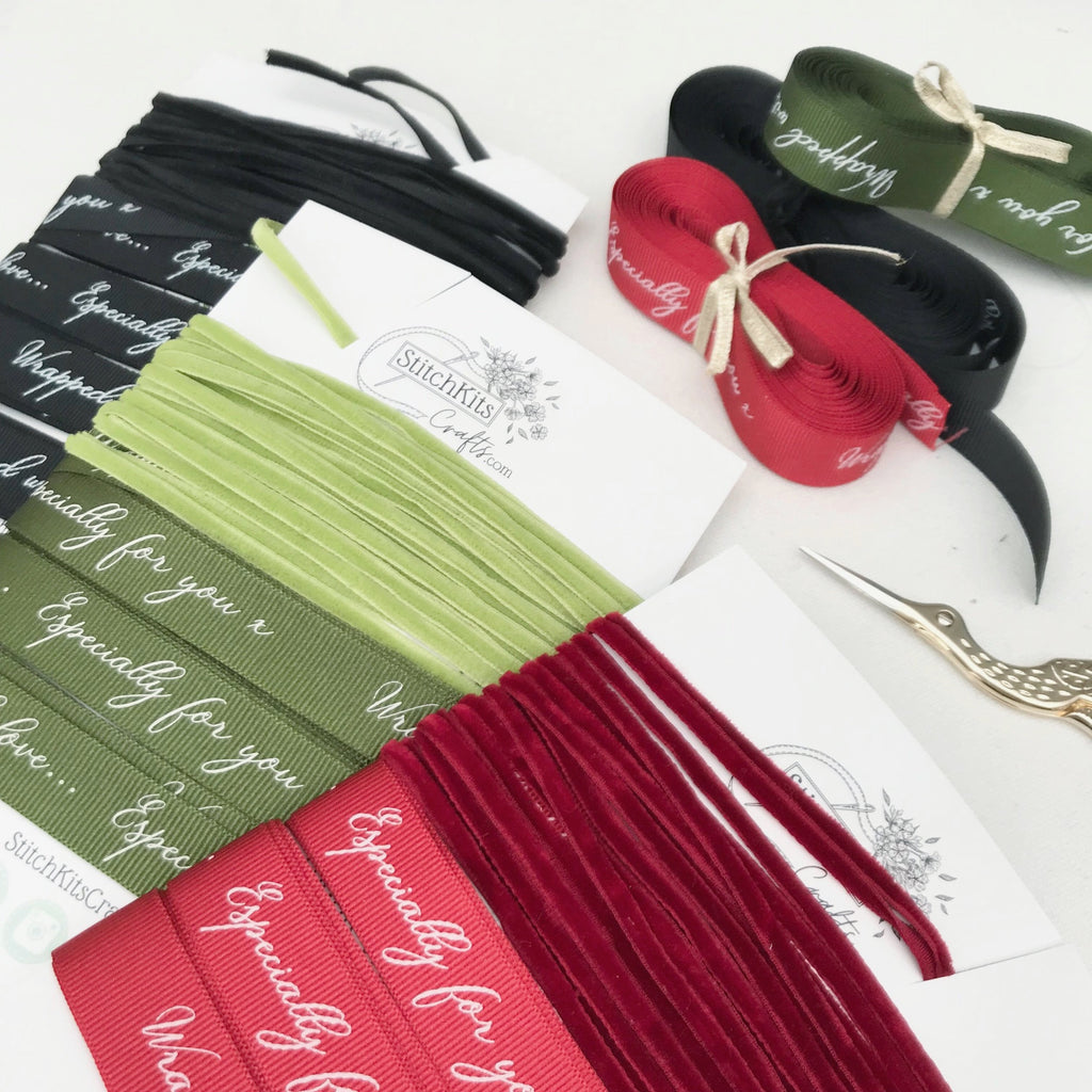 Luxury gift wrapping ribbon in green, black and red.
